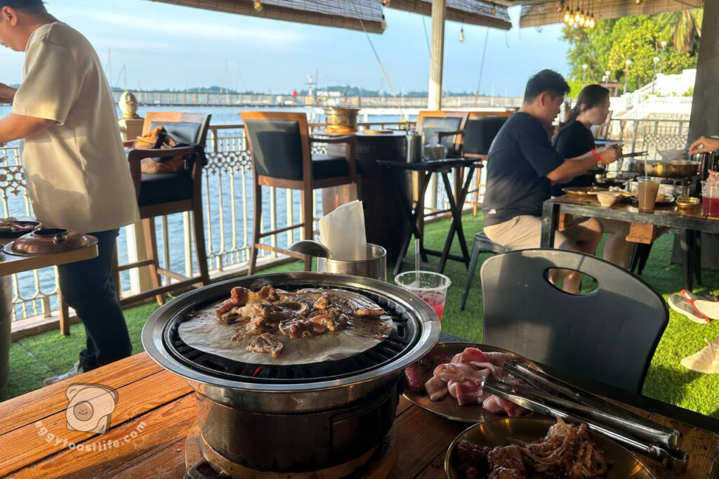 grilling meat by the sea at laut