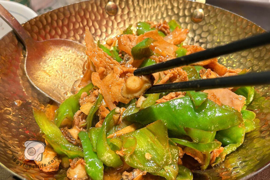 close up of abalone served in hunan pork stir fry